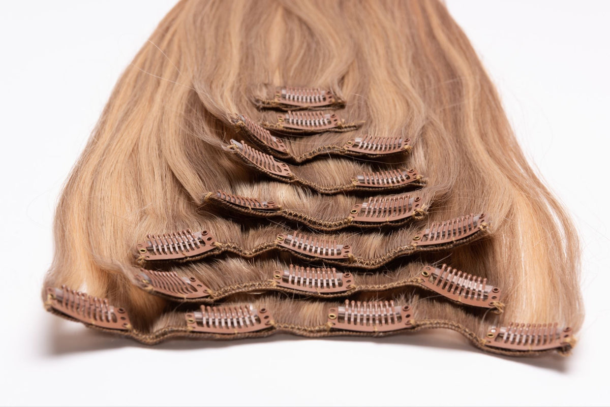 Set of hair extensions stacked on a white background